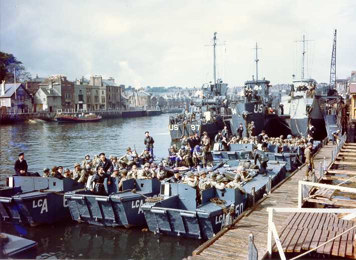 Coast Guard Flotilla 10 tied up in the background along with British landing craft, prepare to sail the English Channel and invade Nazi-occupied France. These landing craft landed U.S. troops on Omaha Beach. Coast Guard Flotilla 10 tied up in the background along with British landing craft, prepare to sail the English Channel and invade Nazi-occupied France. These landing craft landed U.S. troops on Omaha Beach.